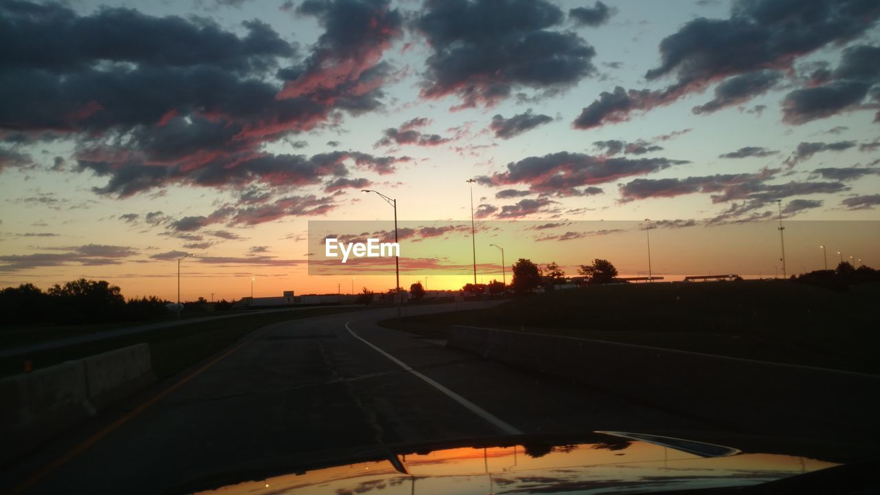 ROAD AGAINST SKY DURING SUNSET