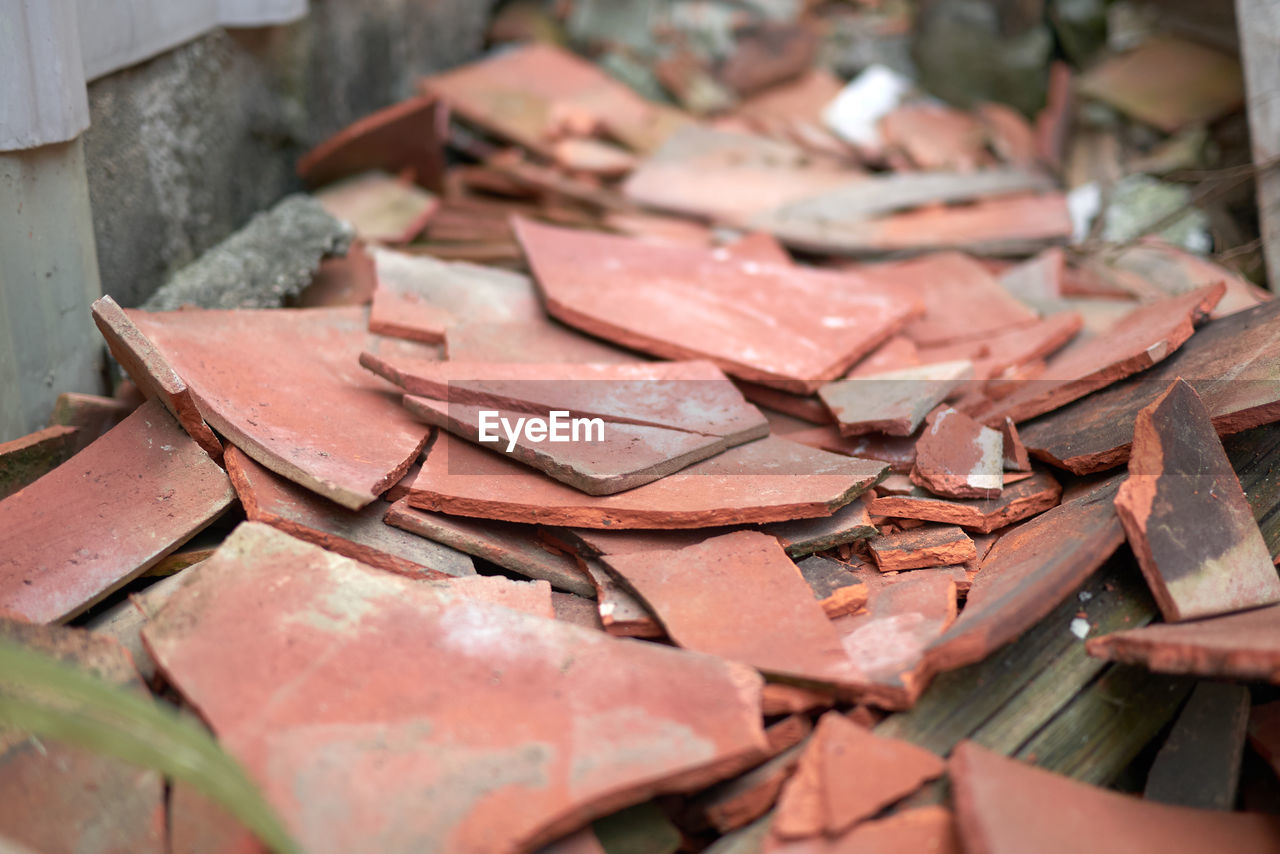 HIGH ANGLE VIEW OF BROKEN METAL CONTAINER