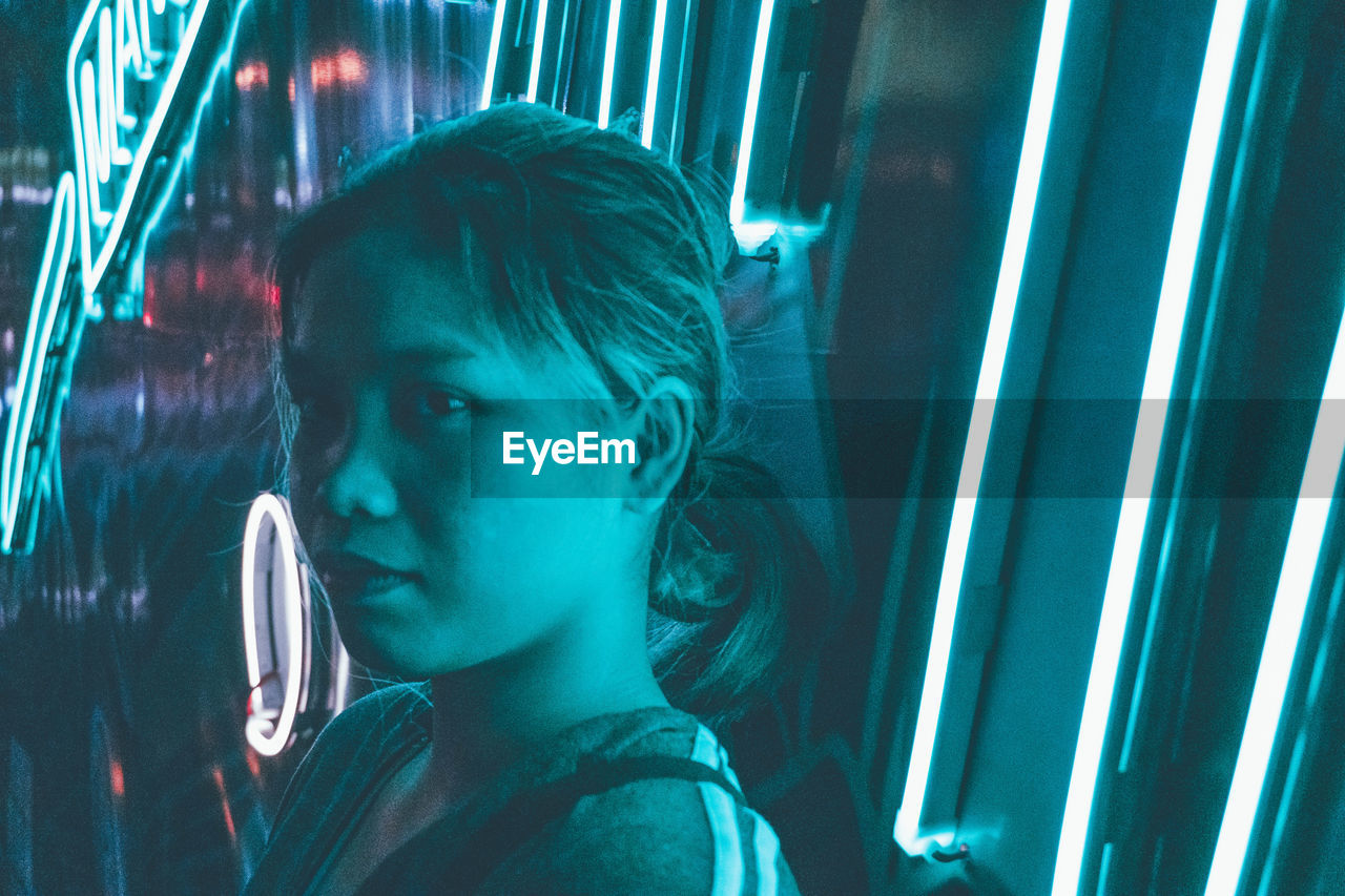 PORTRAIT OF BOY LOOKING THROUGH GLASS WINDOW