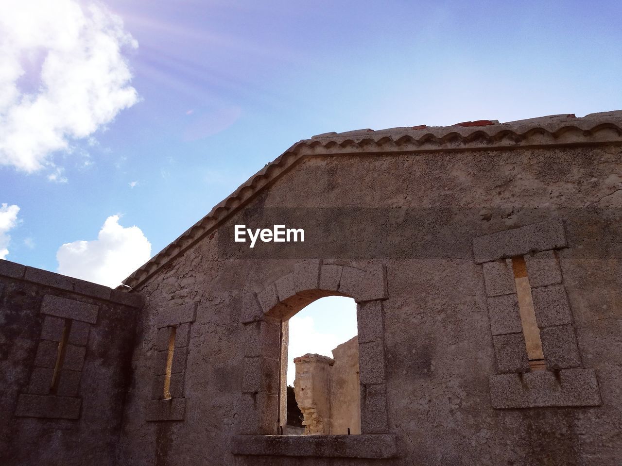 Low angle view of historic building against sky