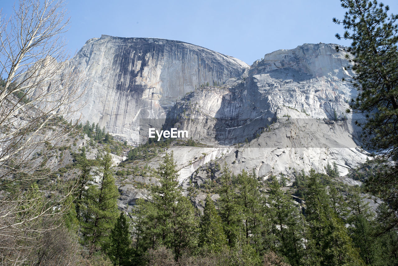 LOW ANGLE VIEW OF ROCKY MOUNTAIN AGAINST SKY