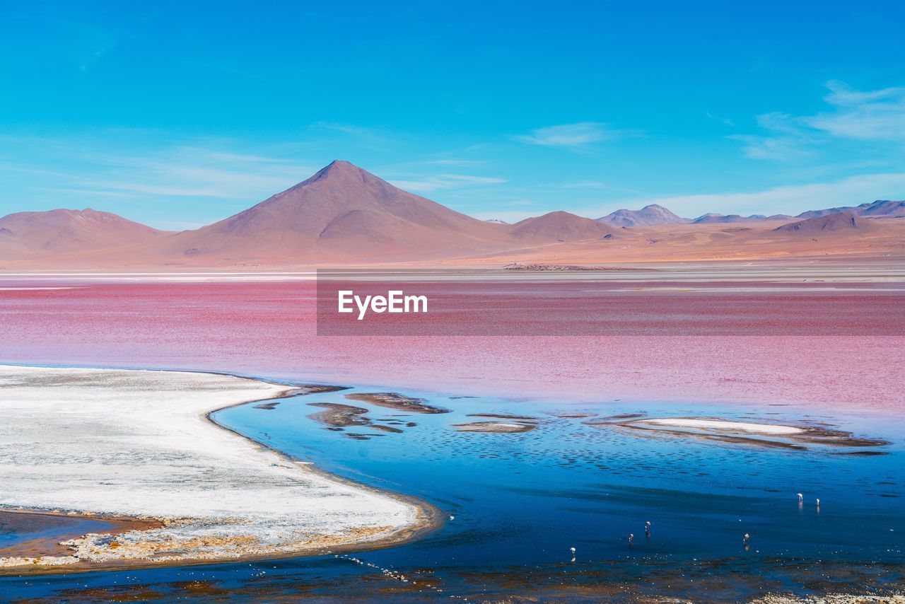 Scenic view of lake against blue sky