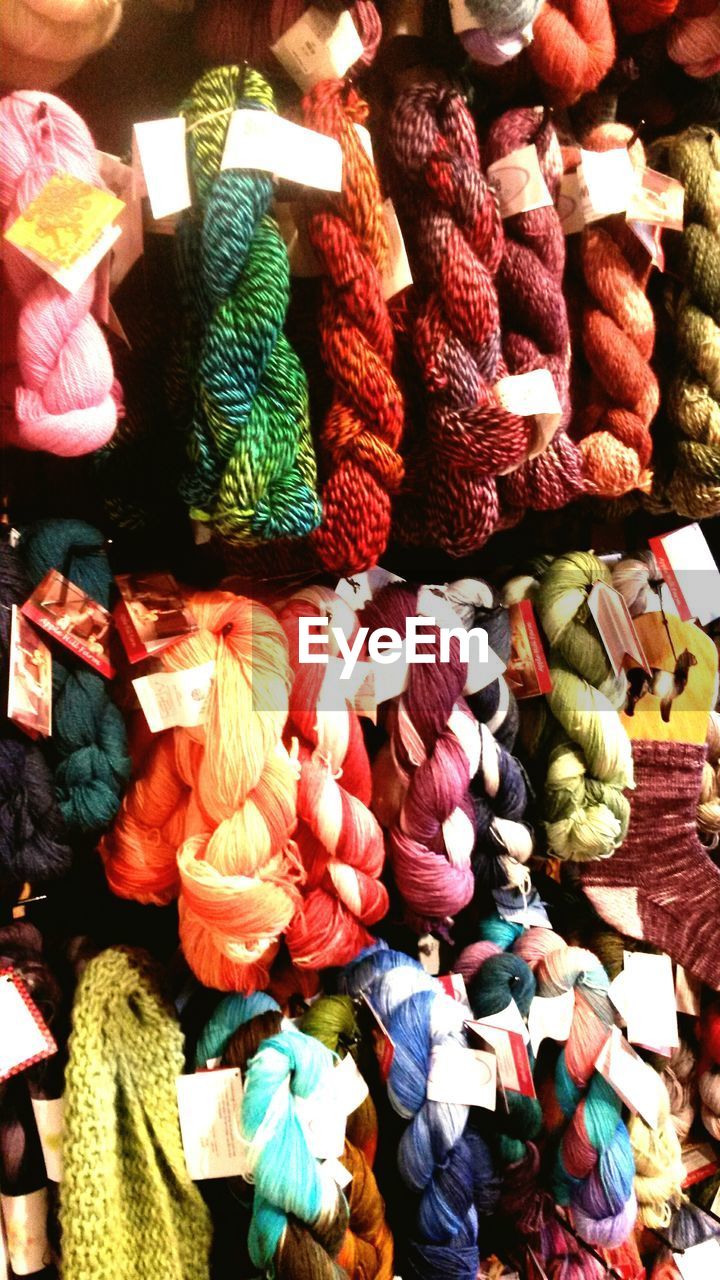 Skeins of colorful yarn for sale at street market