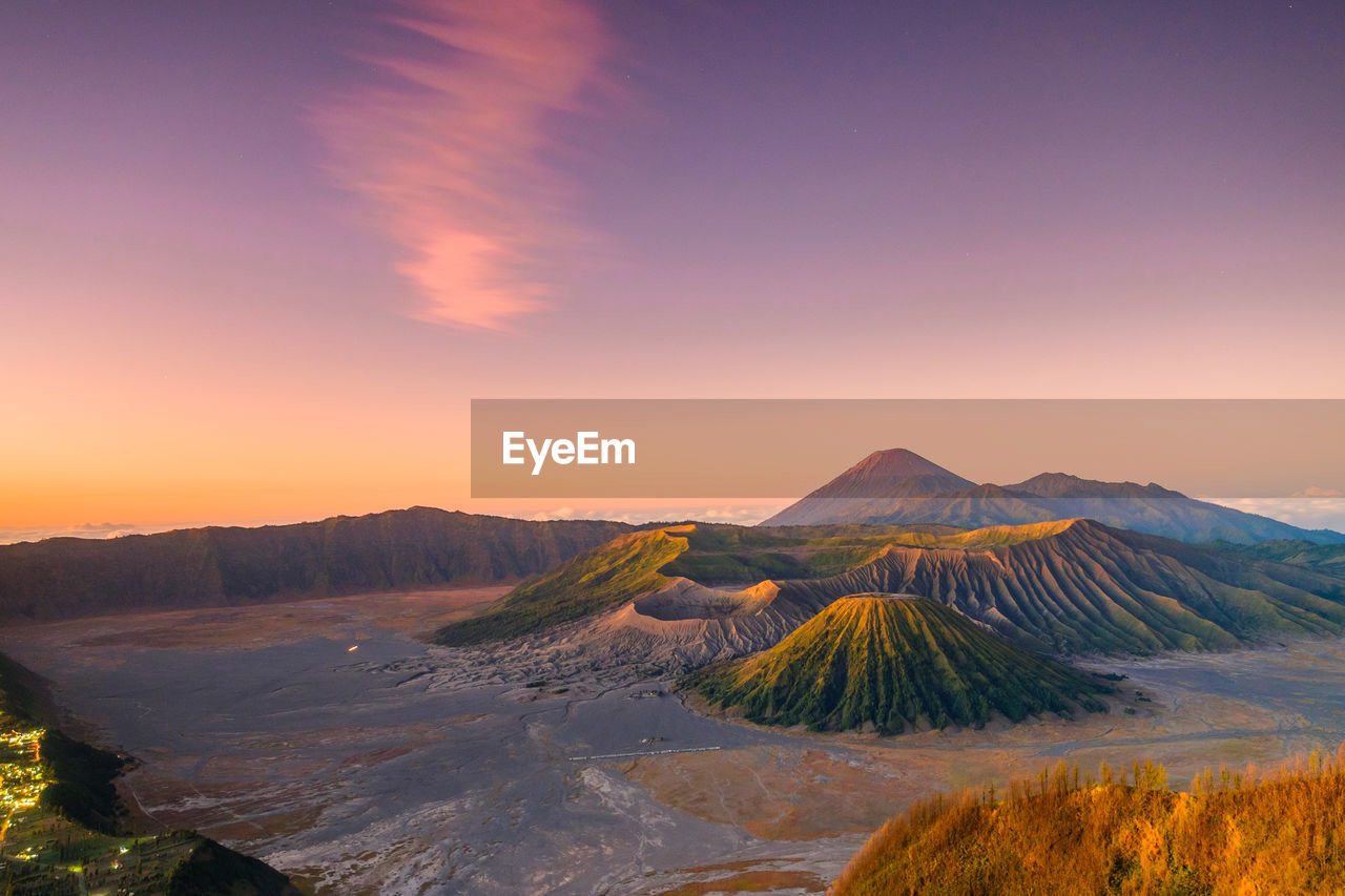 SCENIC VIEW OF VOLCANIC LANDSCAPE AGAINST SKY DURING SUNSET