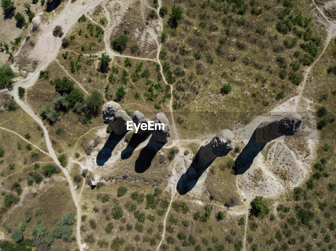 HIGH ANGLE VIEW OF PEOPLE ON DESERT