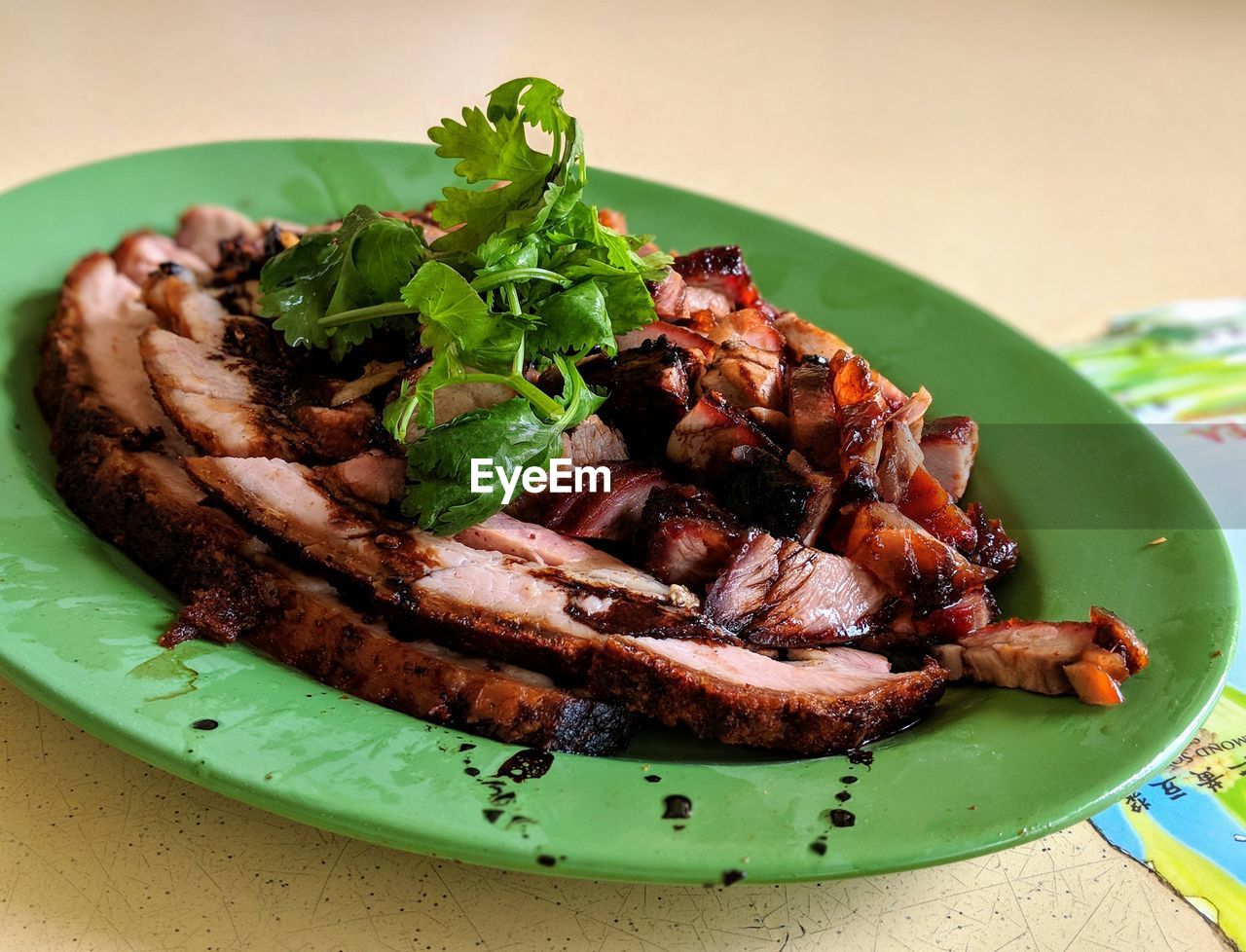 Close-up of meat in plate on table