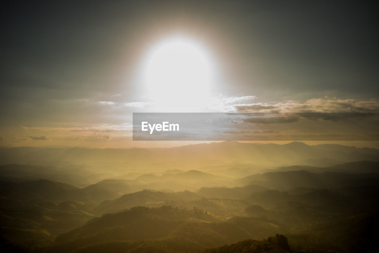 Scenic view of mountains against sky during sunset