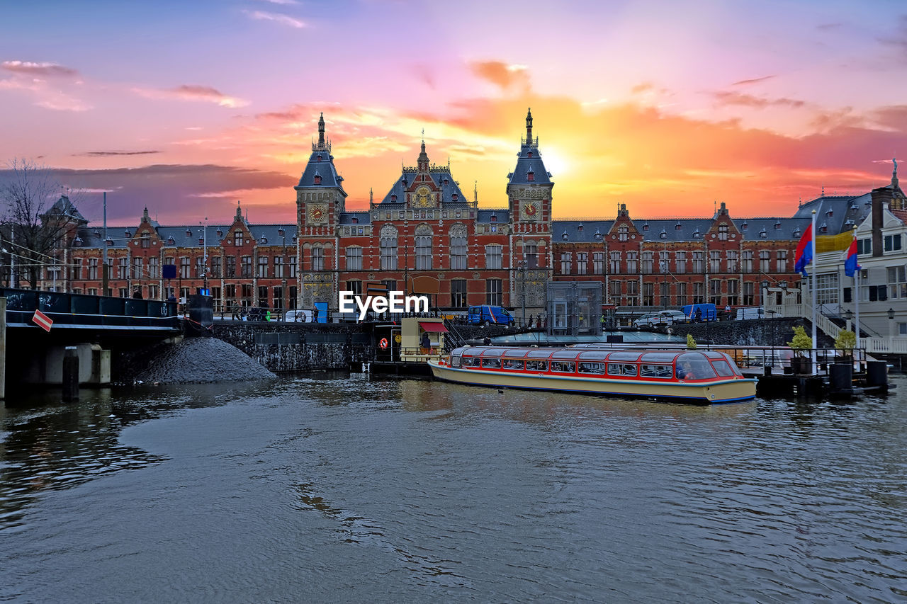 Central station in amsterdam netherlands at sunset