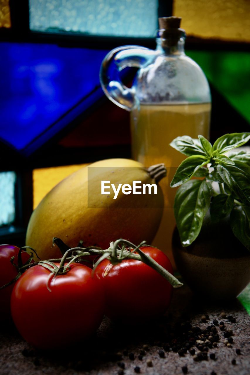CLOSE-UP OF FRUITS ON GLASS TABLE