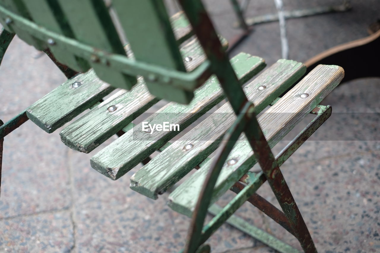 Close-up of empty wooden chair on floor