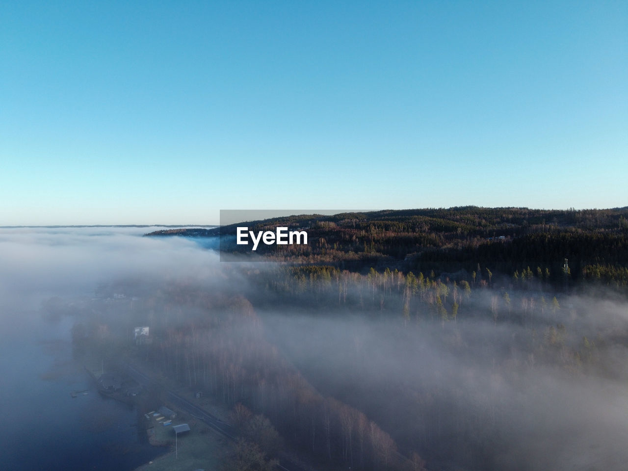 Scenic view of land against clear blue sky