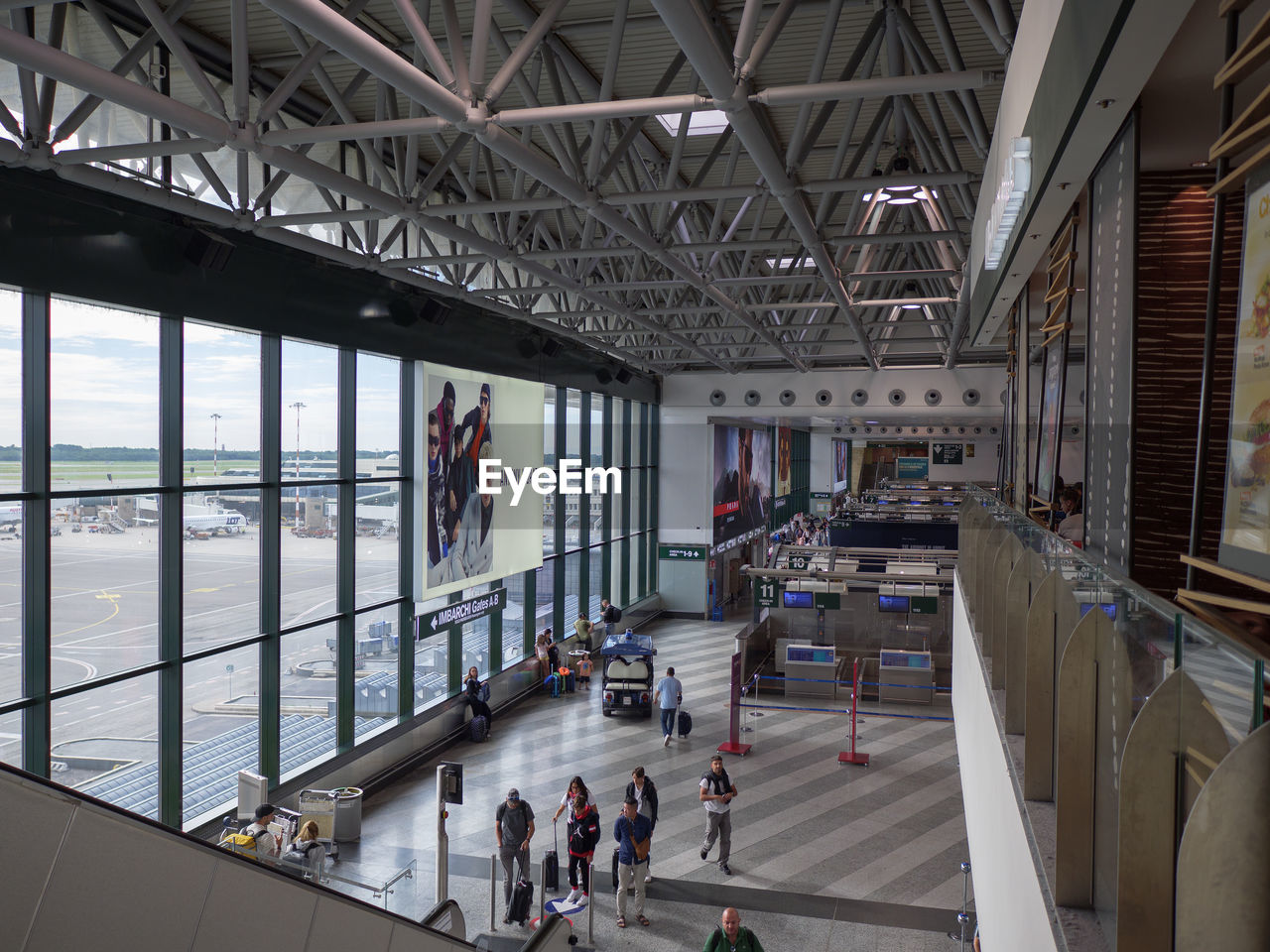 architecture, group of people, built structure, indoors, public transport, transport, transportation, travel, large group of people, men, adult, crowd, women, building, mode of transportation, city, day, lifestyles, travel destinations, walking, tourism, high angle view, city life