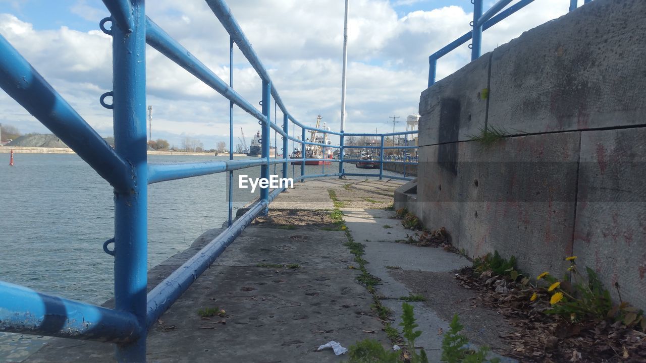 VIEW OF NARROW WALKWAY ALONG BUILDINGS