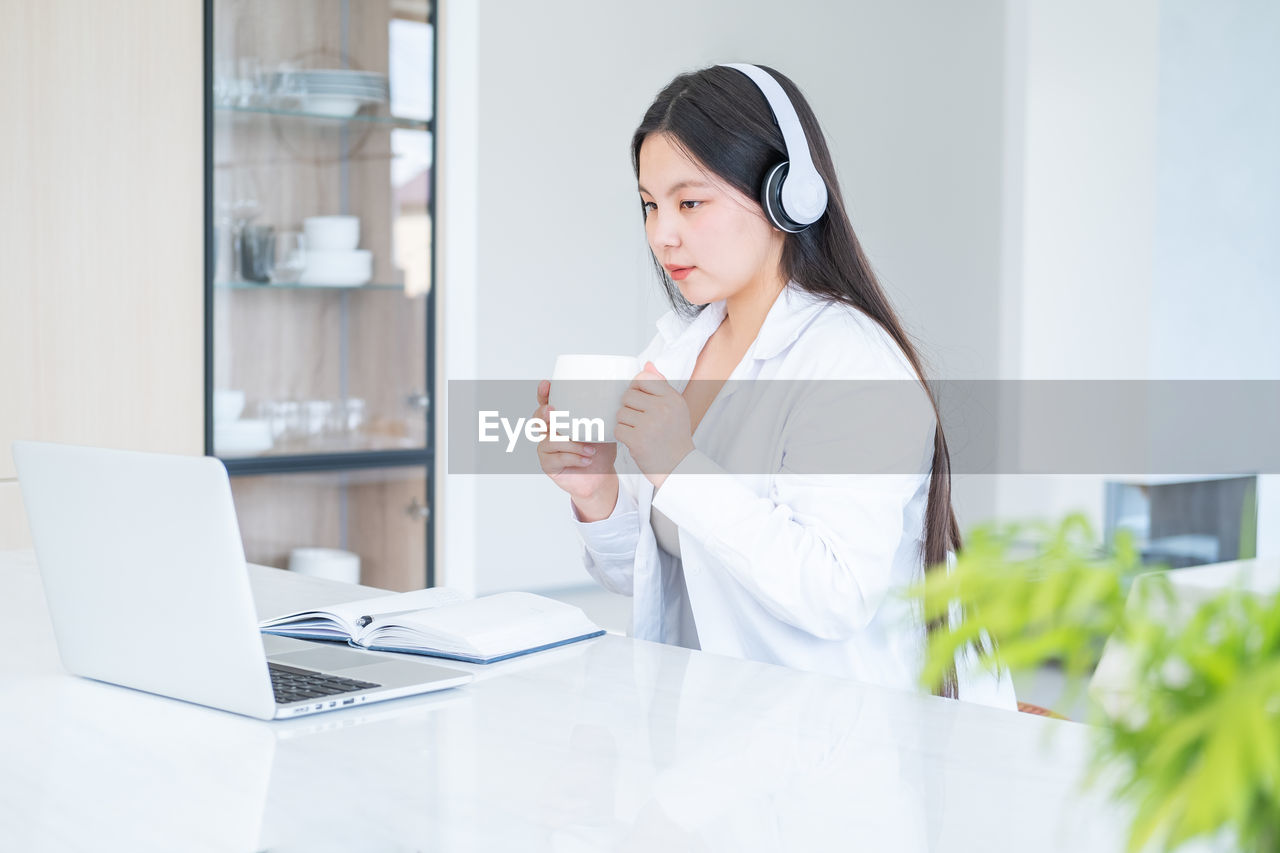 Young businesswoman working at office