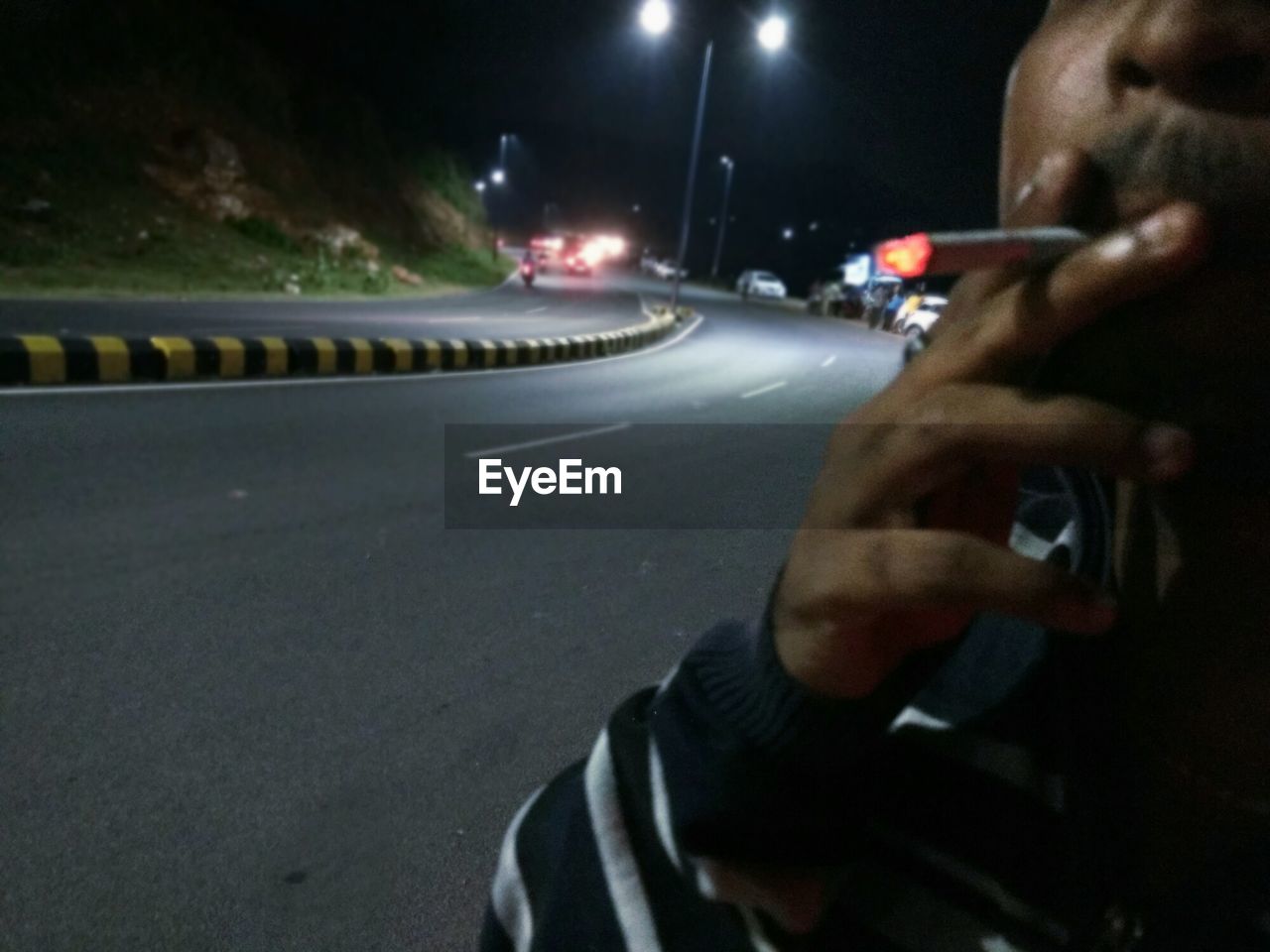 CLOSE-UP OF HAND ON THE ROAD