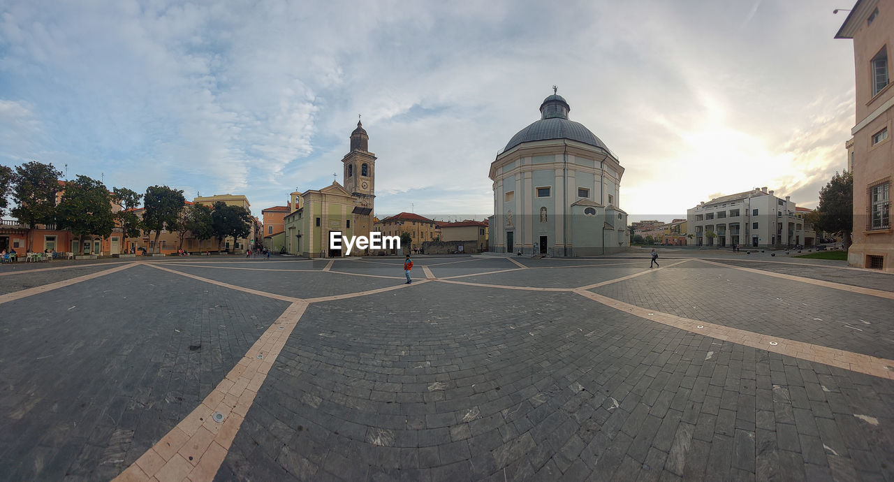 architecture, built structure, sky, building exterior, city, religion, travel destinations, cloud, travel, nature, building, belief, place of worship, history, the past, spirituality, dome, street, road, tourism, landmark, symbol, transportation, outdoors, day, politics and government, government, sunset, town square