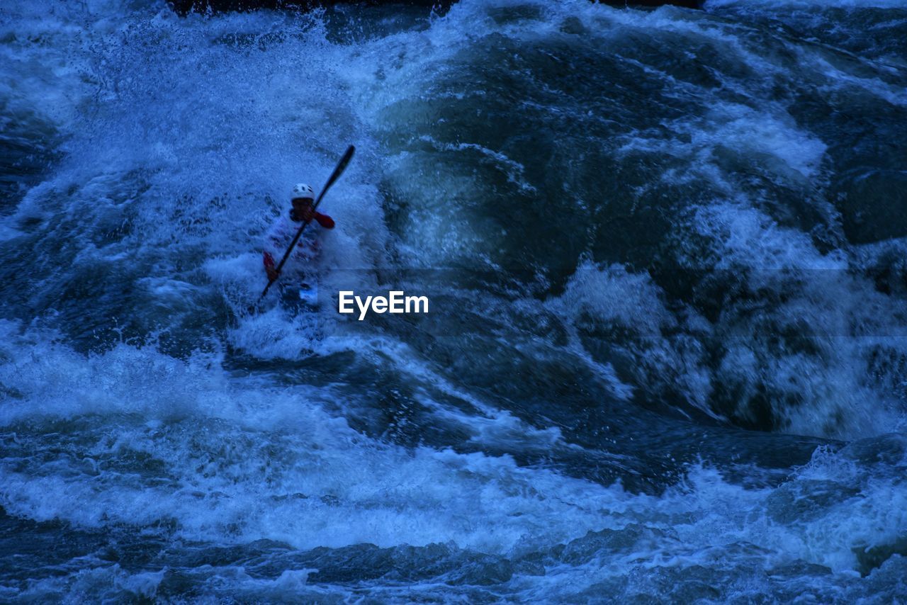 High angle view of man rafting in river