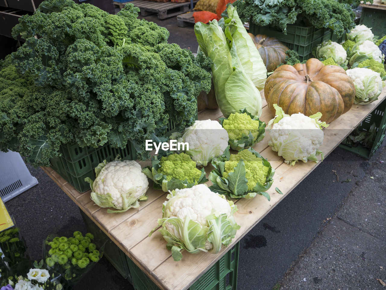 HIGH ANGLE VIEW OF VARIOUS VEGETABLES IN MARKET