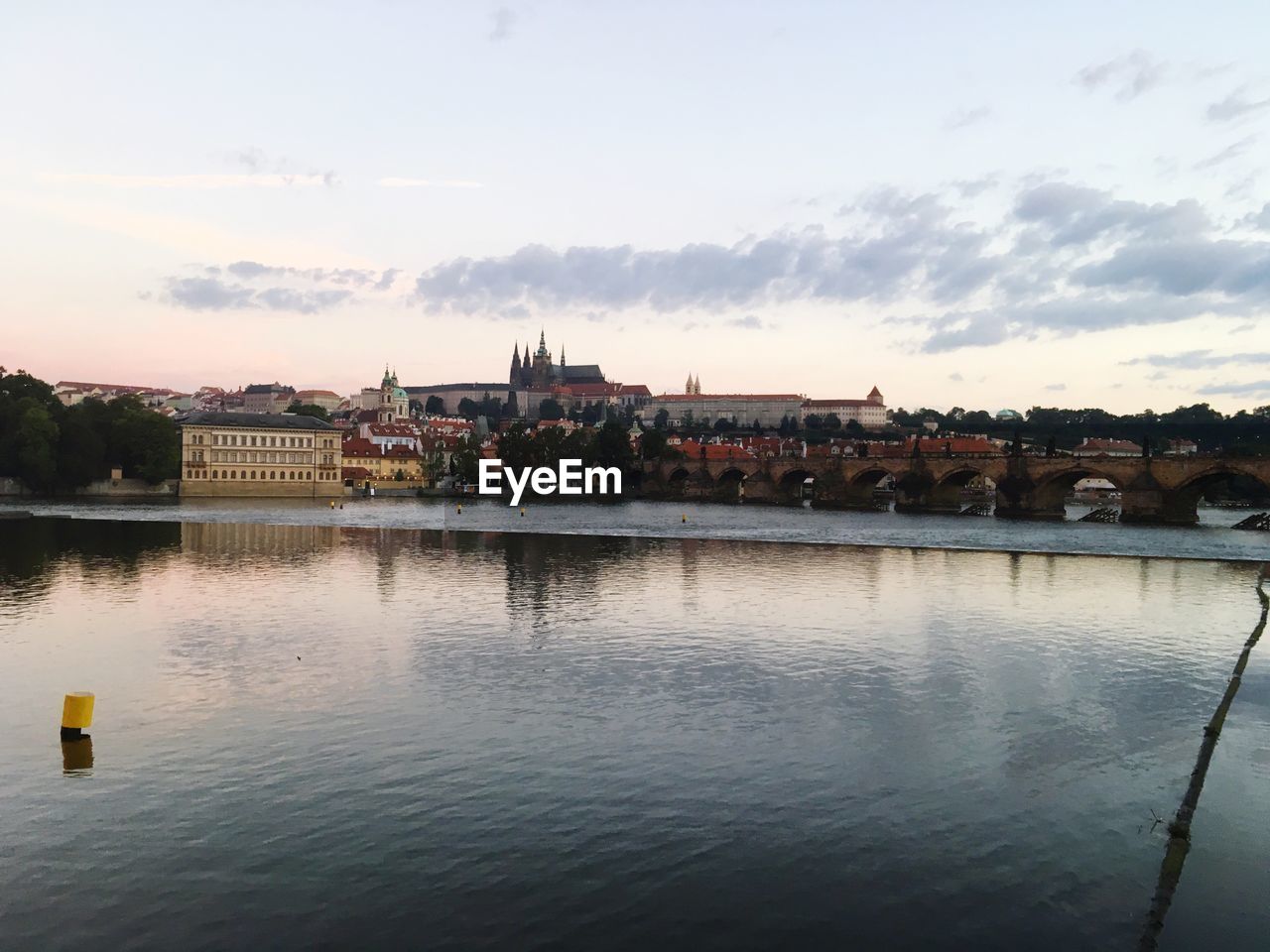 VIEW OF BUILT STRUCTURES AGAINST RIVER