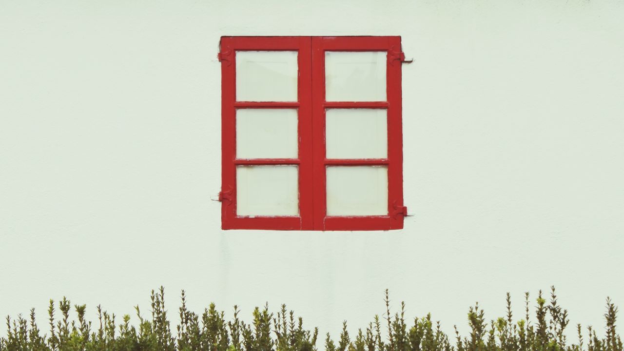 Close-up of wall with closed red window