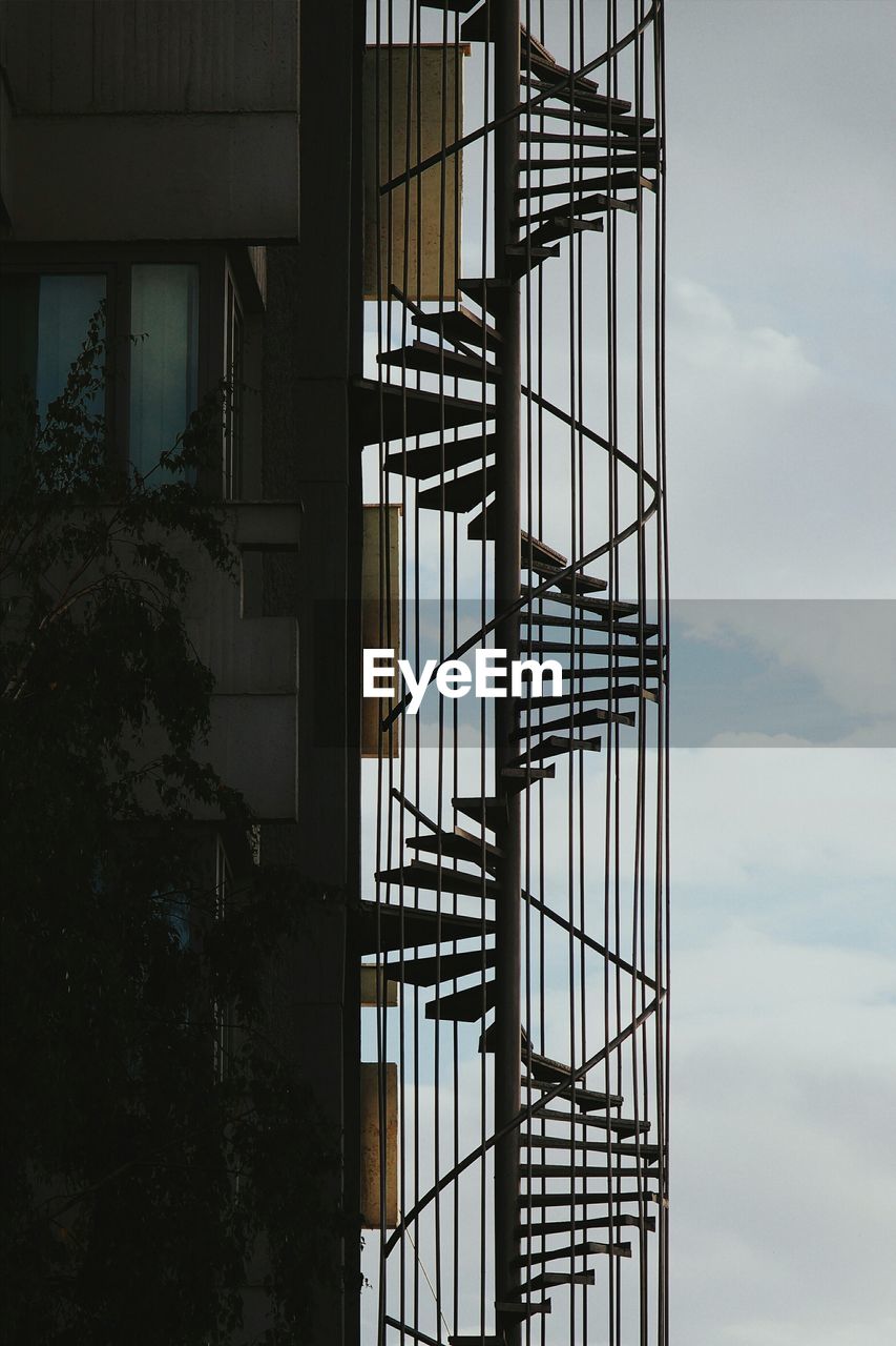 Low angle view of spiral stairs against the sky