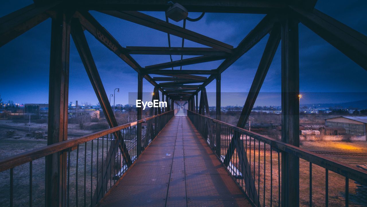 Bridge over footbridge against sky