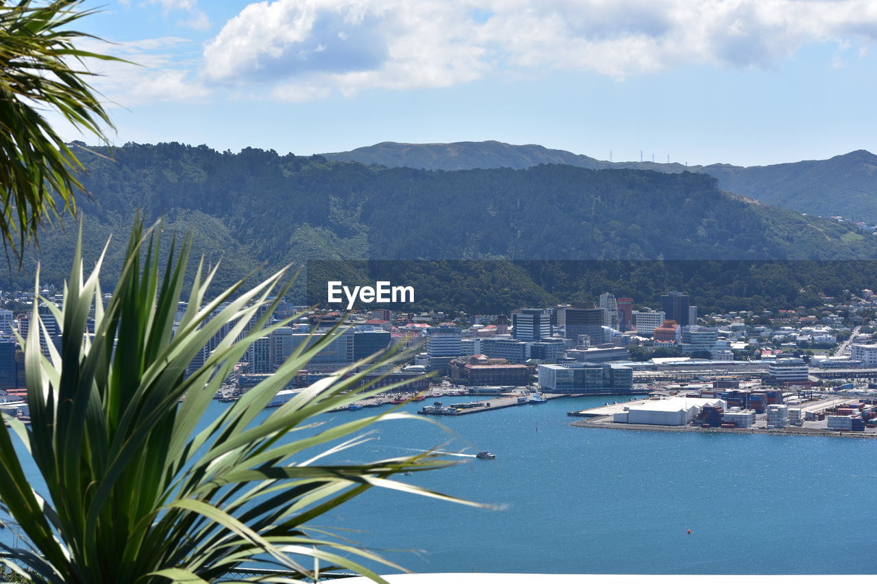 Scenic view of sea and mountains against sky