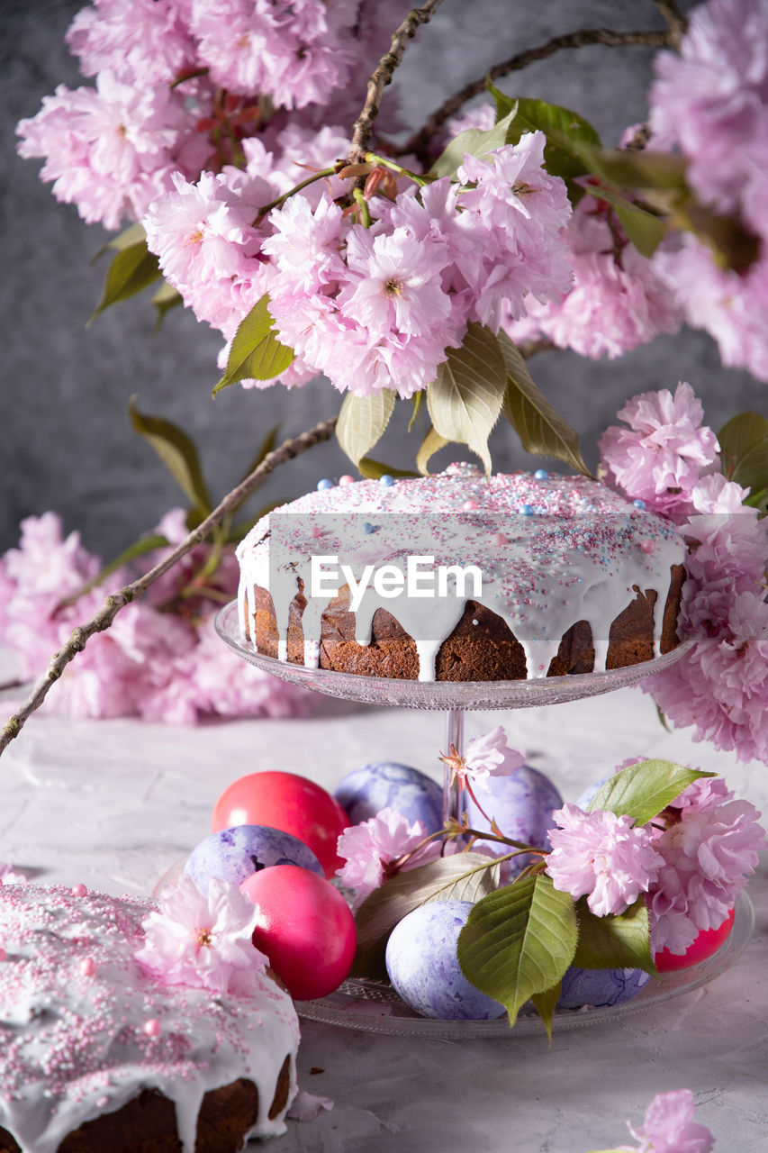 Beautiful easter cake on the table, and colored eggs, homemade cakes, still life