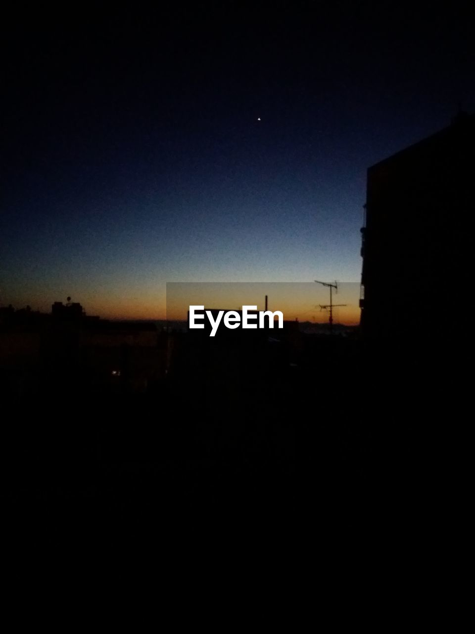 SILHOUETTE OF BUILDINGS AT NIGHT