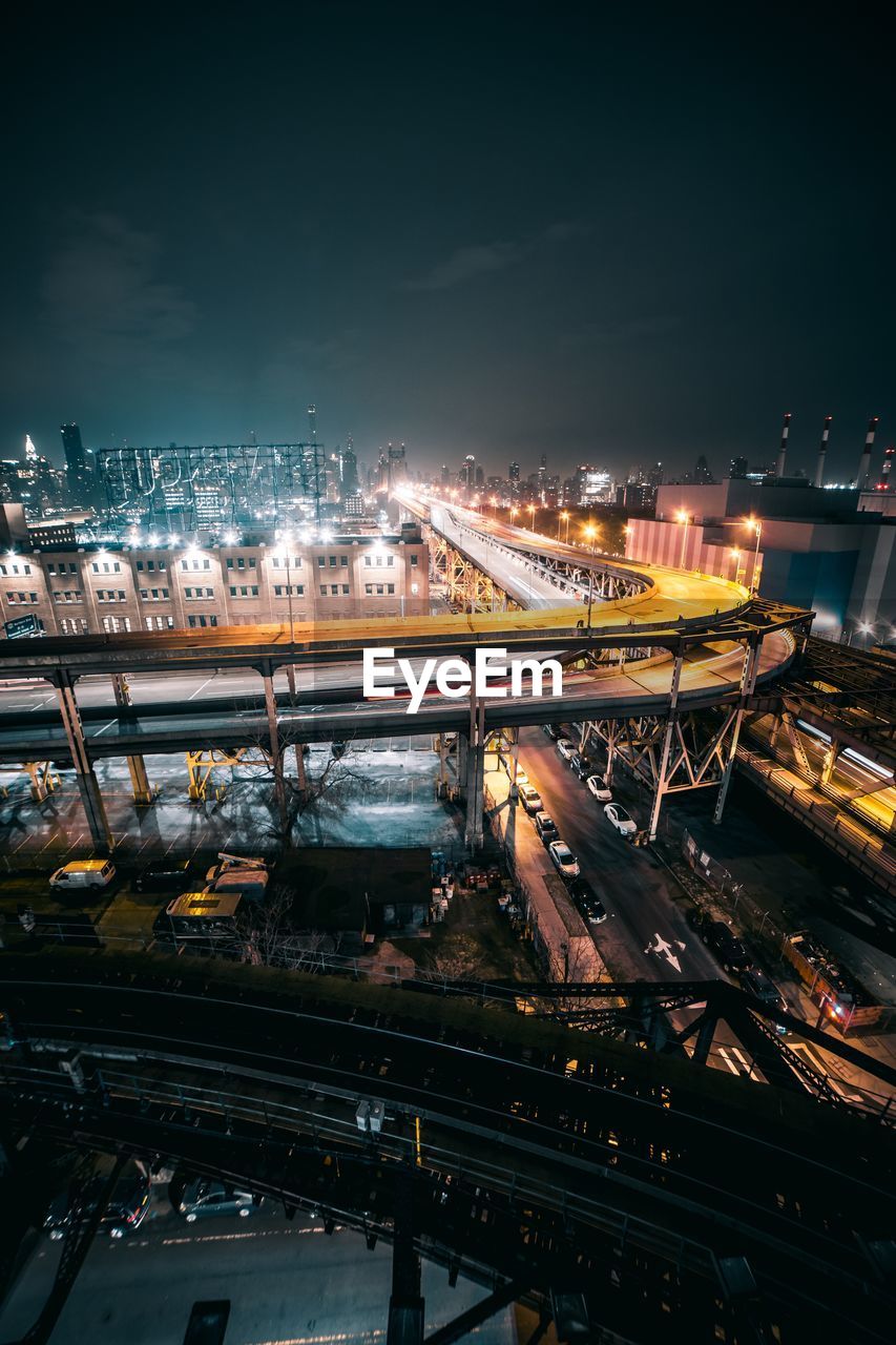 HIGH ANGLE VIEW OF LIGHT TRAILS ON STREET AT NIGHT