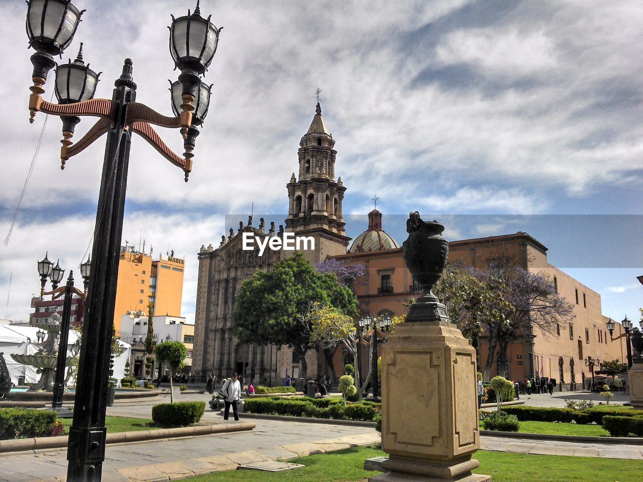 People walking in front of church at san luis potosi