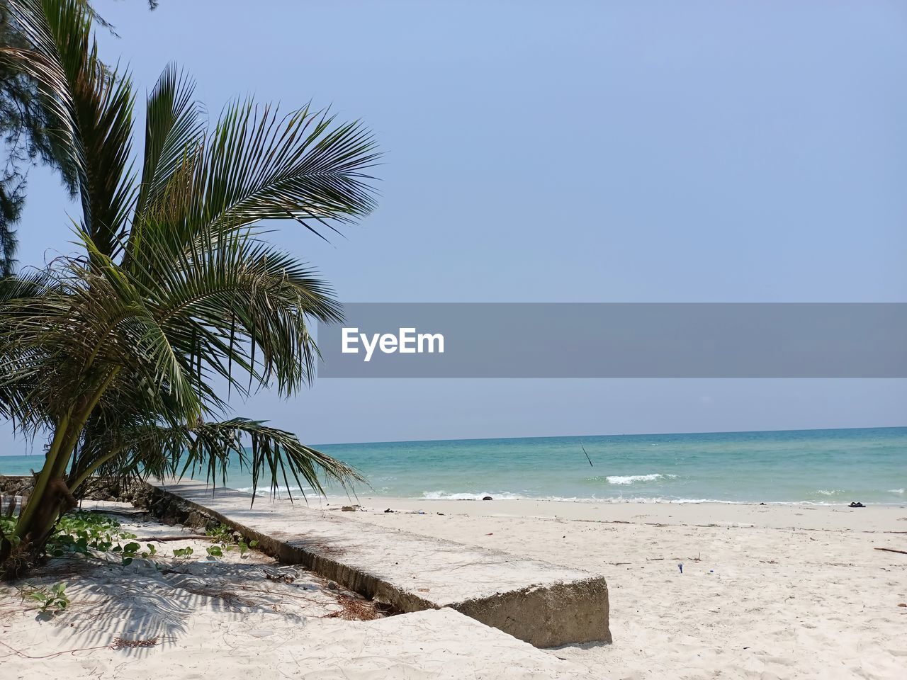 Ban Chuen Beach in Trat Province, Thailand Tree Water Clear Sky Sea Palm Tree Beach Sand Blue Sunny Wave Seascape Coconut Palm Tree Rocky Coastline Palm Leaf Coconut Island