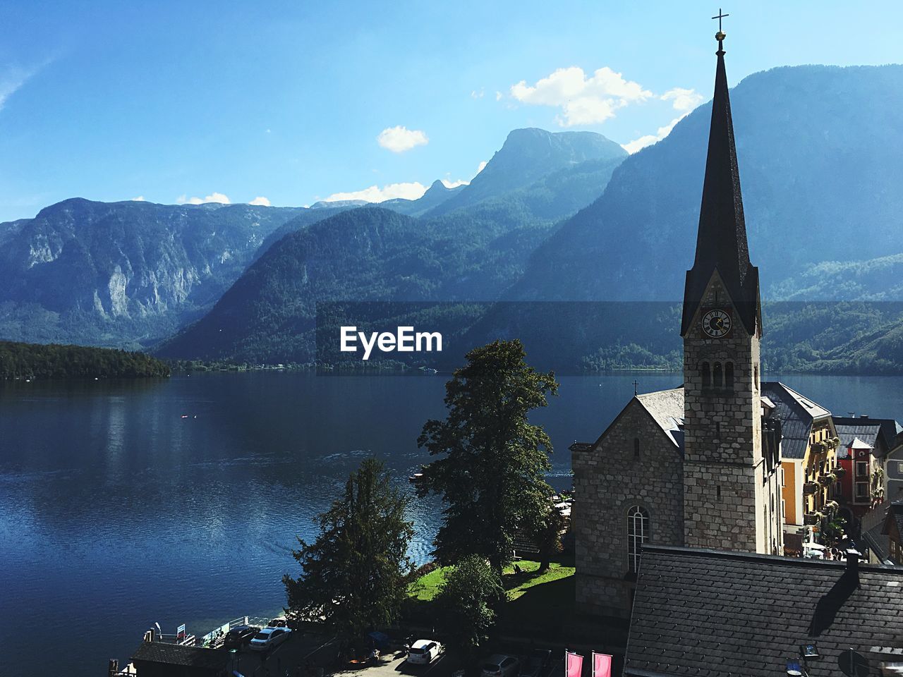 High angle view of church by lake against mountains