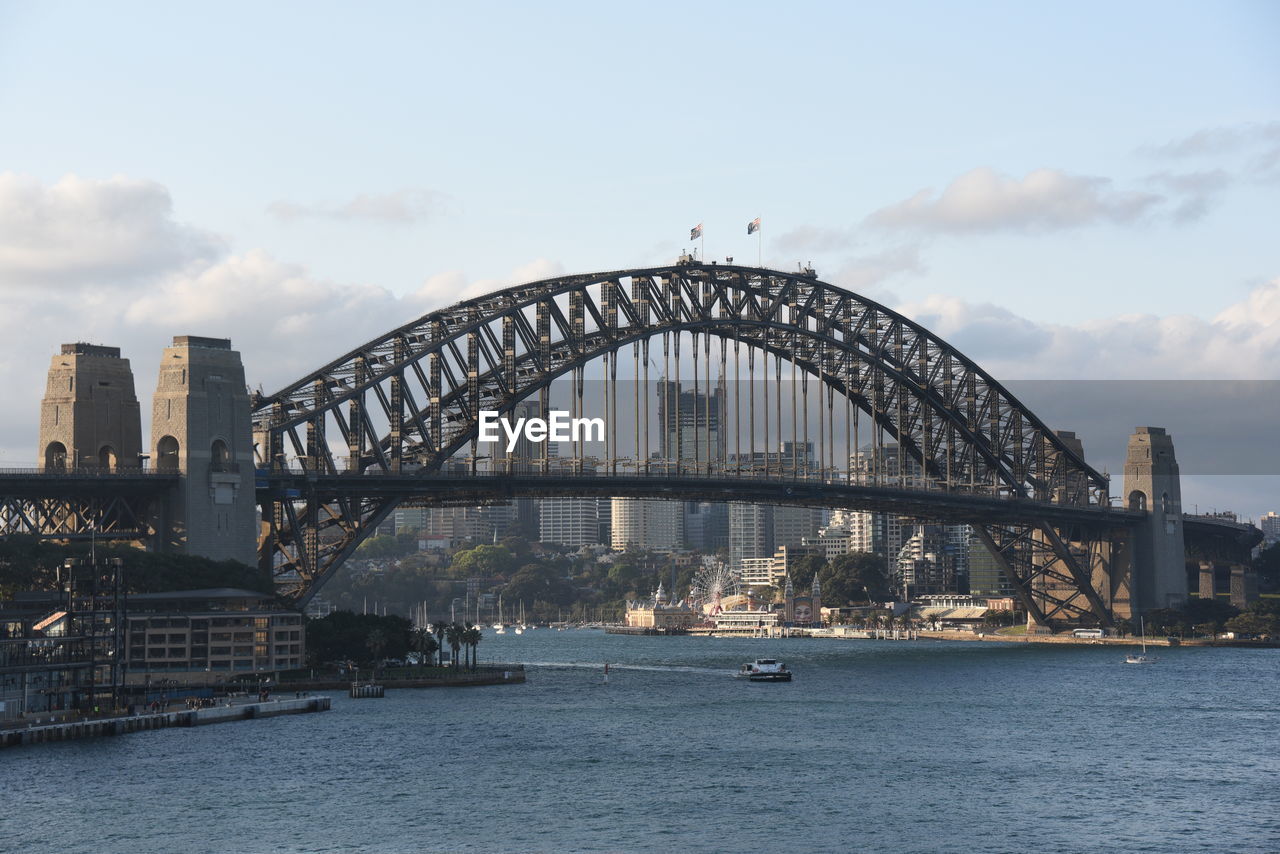 View of bridge over river against cloudy sky