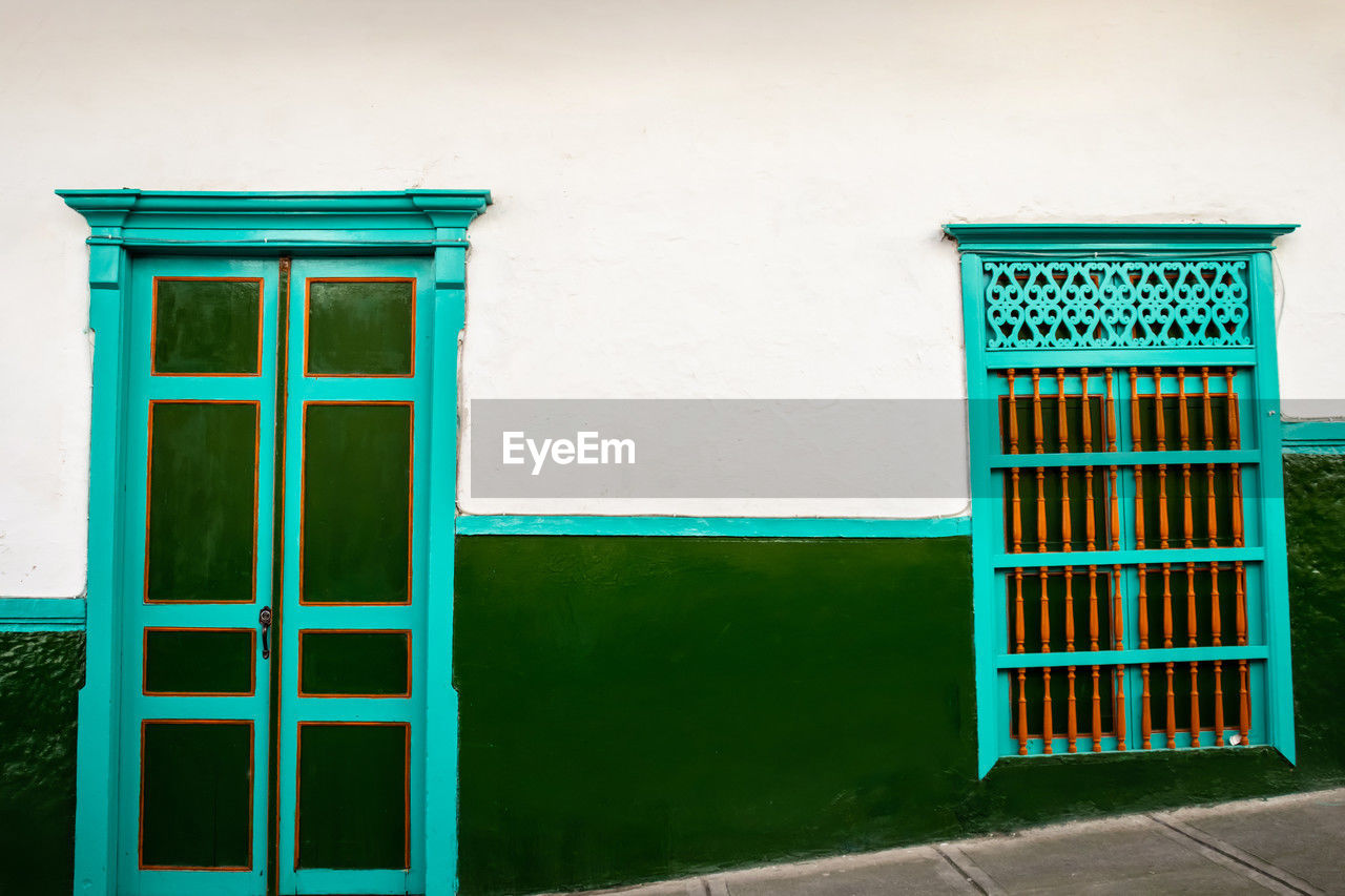 













facade of the houses at the heritage town of salamina in colombia.