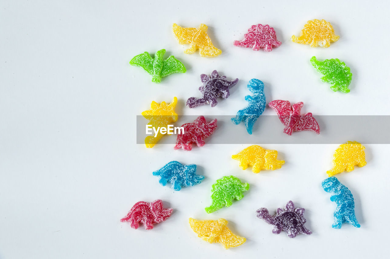 Dinosaurs jelly bonn, candies on the white background, colorful jelly