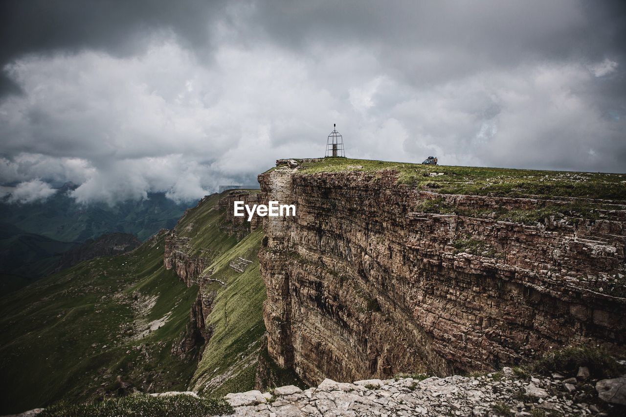 Mountain against cloudy sky