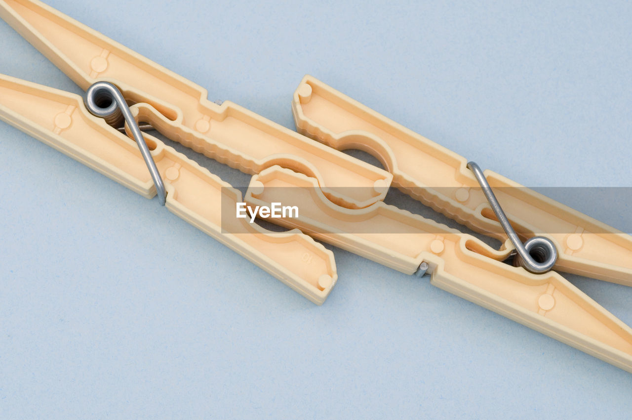 High angle view of clothespins on white background