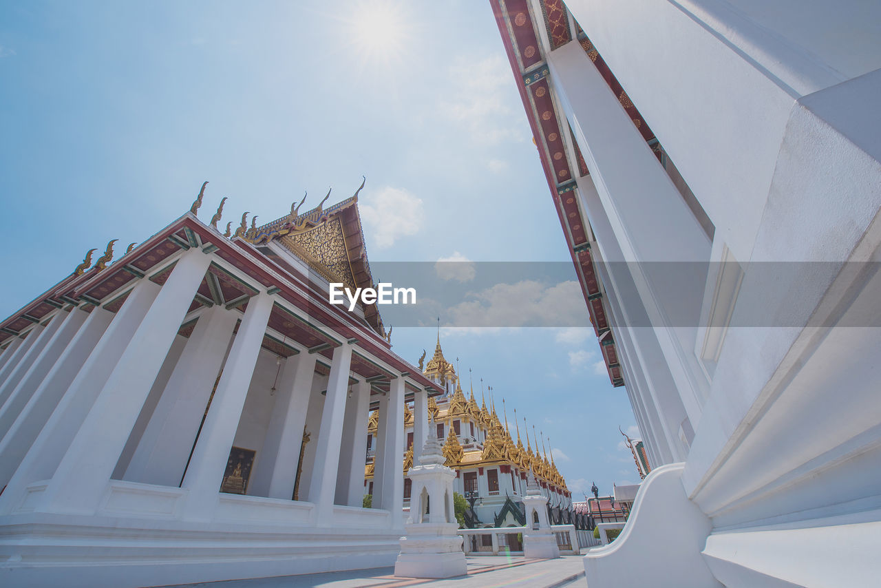 LOW ANGLE VIEW OF TRADITIONAL BUILDING AGAINST SKY IN BACKGROUND