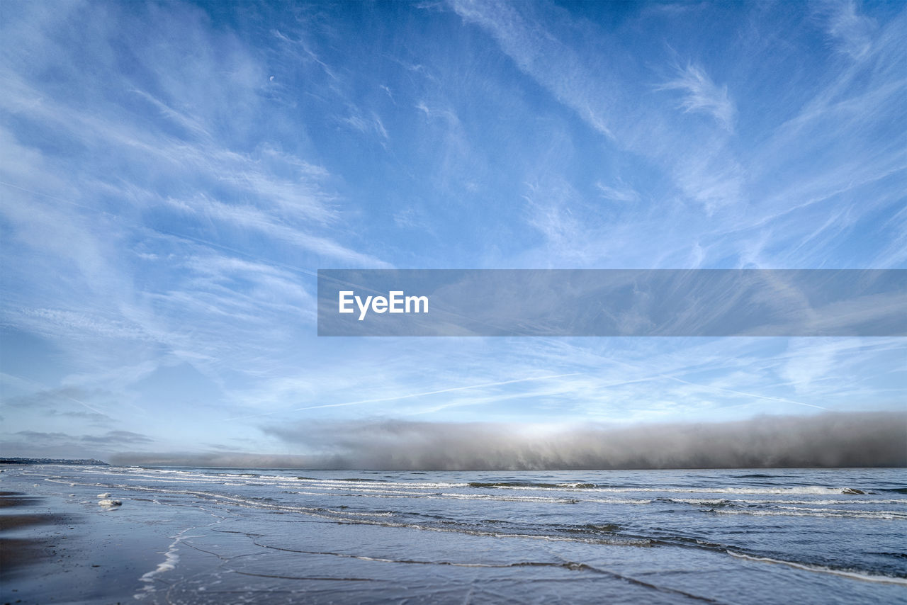 SCENIC VIEW OF SNOW COVERED LANDSCAPE AGAINST BLUE SKY