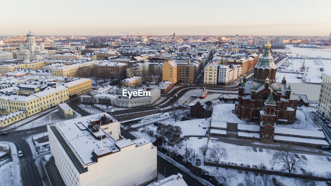 HIGH ANGLE VIEW OF BUILDINGS DURING WINTER