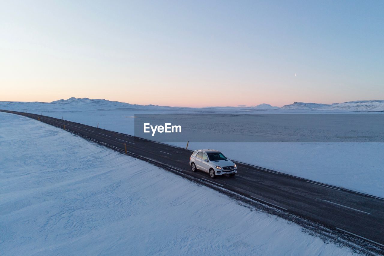 Scenic view of snowcapped mountain against sky during winter