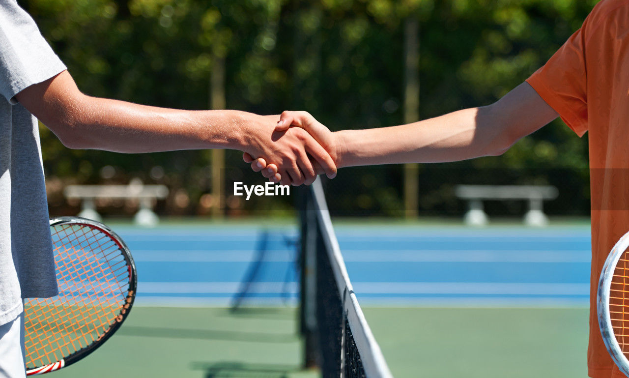 low section of man playing tennis