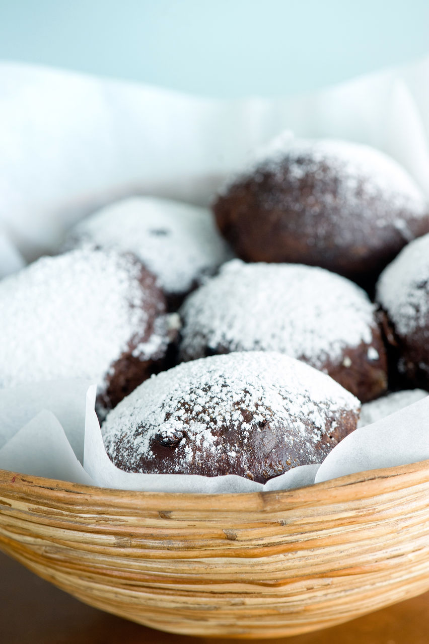 Close-up of chocolate buns in wicker basket