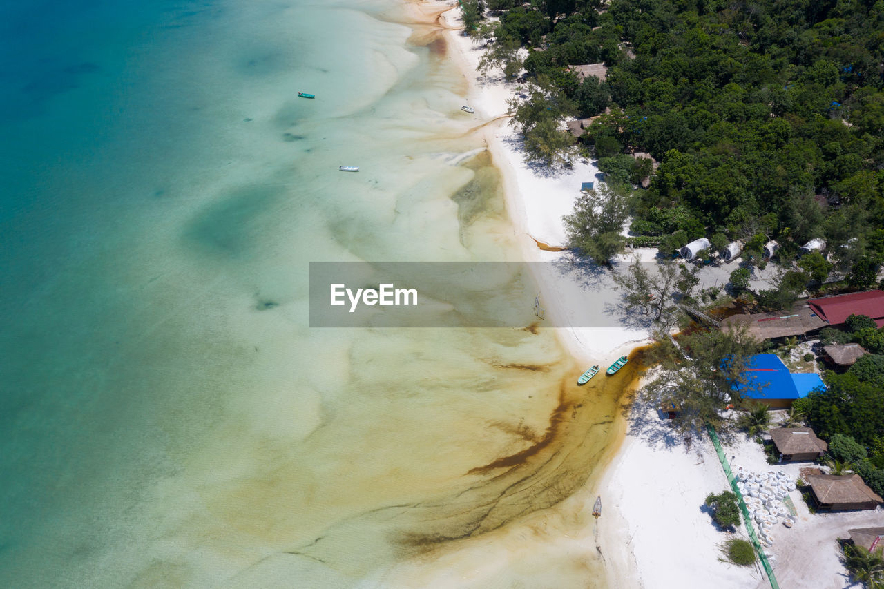 HIGH ANGLE VIEW OF SWIMMING POOL AT SEASIDE