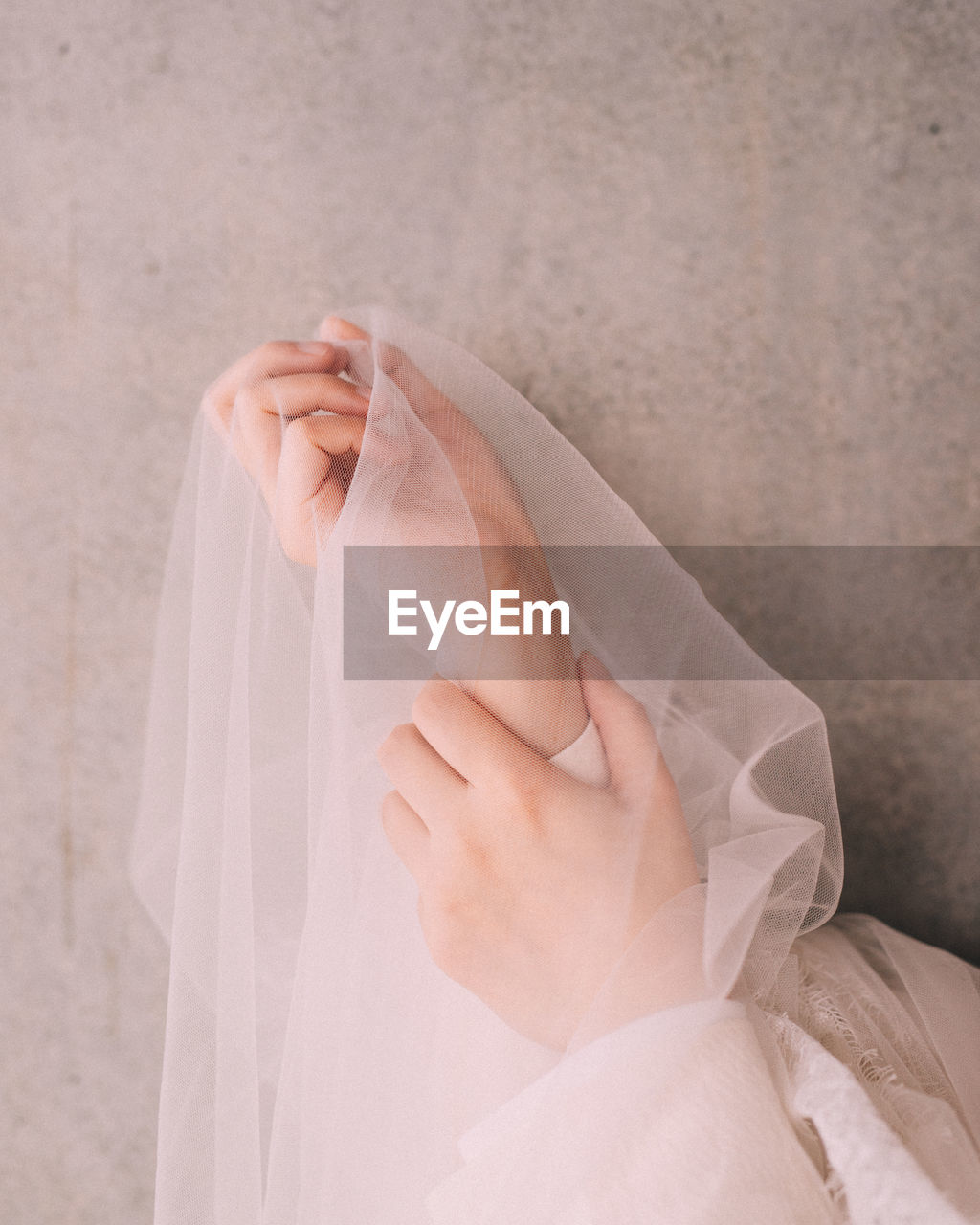 Close-up of woman holding veil