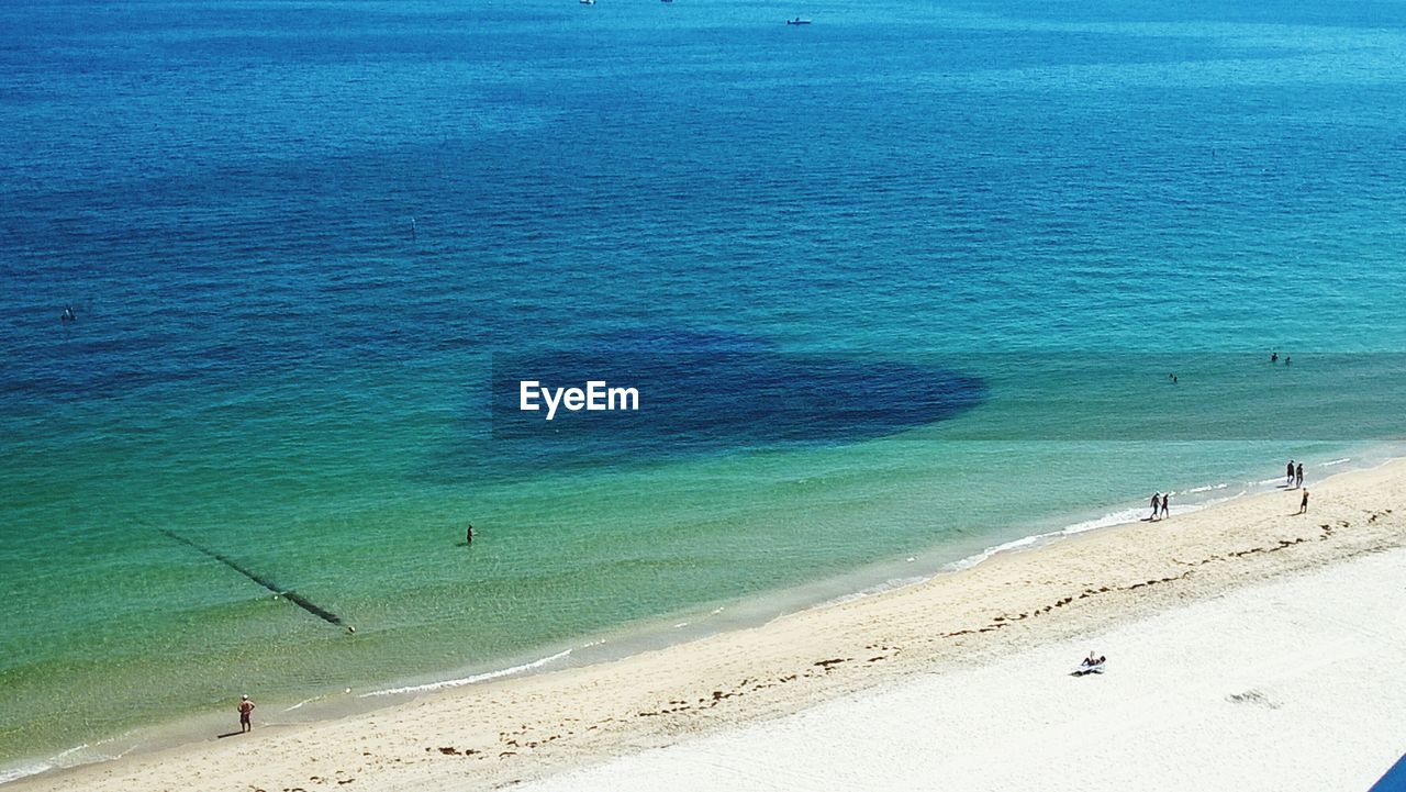 High angle view of people at beach and sea