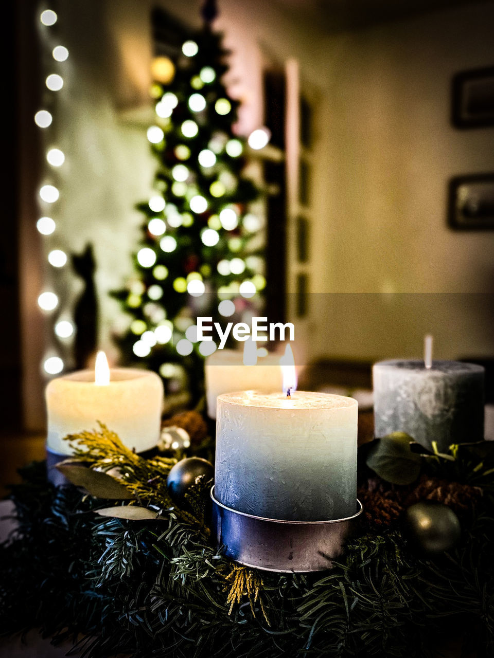christmas, decoration, candle, holiday, fire, celebration, burning, christmas tree, christmas decoration, flame, tree, interior design, illuminated, plant, nature, indoors, tradition, candle holder, home interior, christmas ornament, domestic room, christmas lights, no people, lighting, gift, event, light, domestic life, fir tree, living room, heat, atmospheric mood, coniferous tree, winter, focus on foreground, tranquility, lighting equipment, religion, glowing, still life, wreath, pinaceae, dark, advent, night, lifestyles, flameless candle, selective focus, table