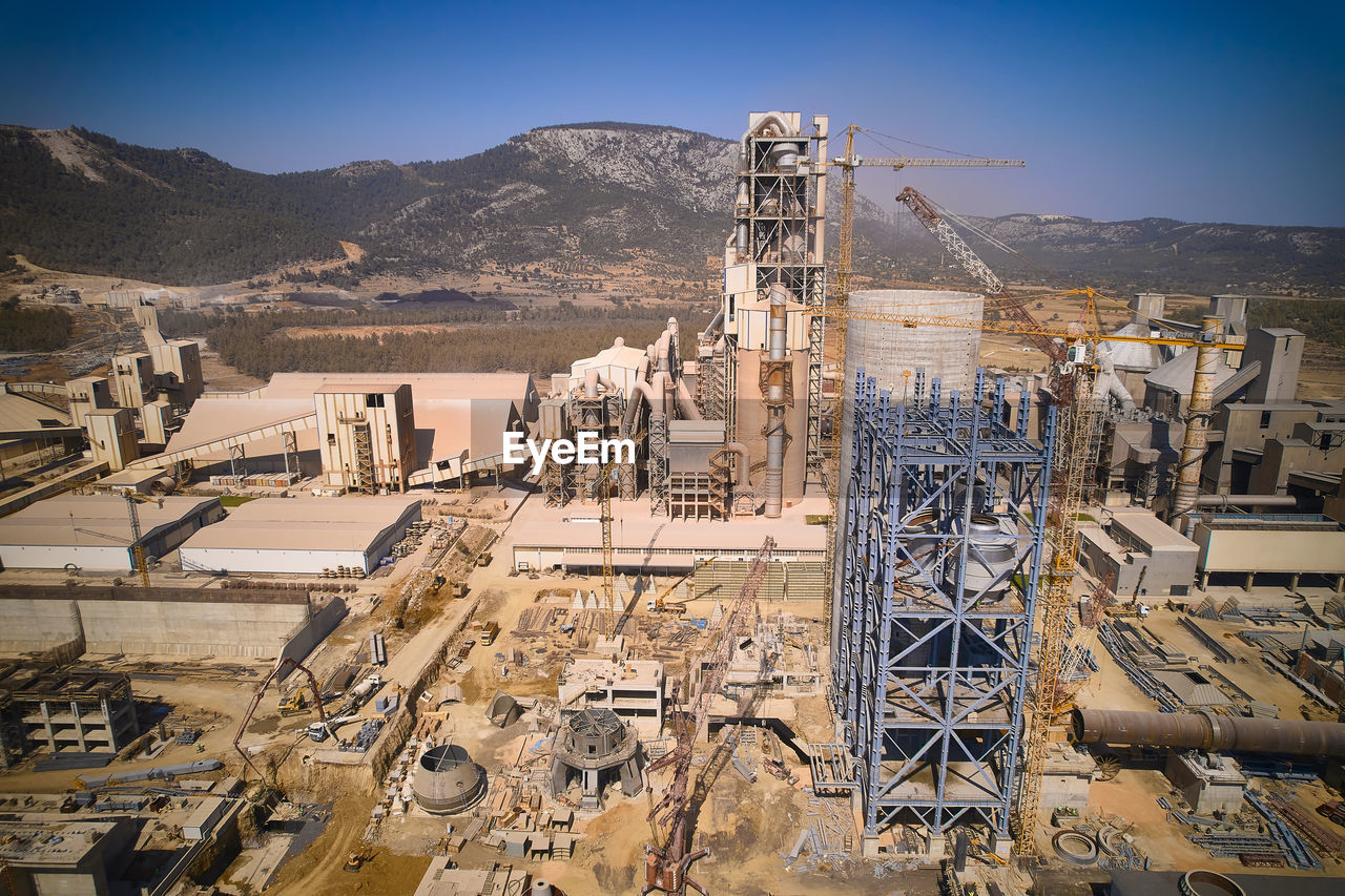 Structures of cement producing plant. aerial view of huge industrial factory.