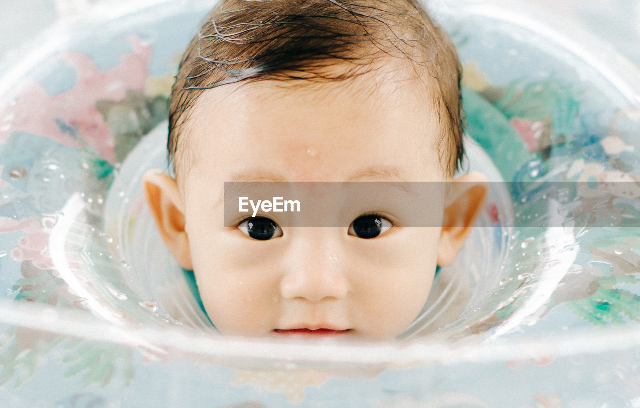 Close-up of boy playing with water